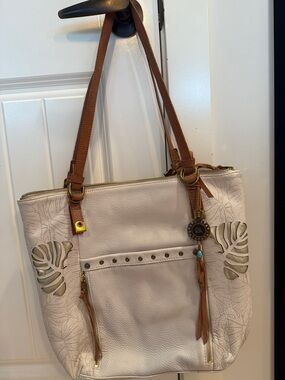The Sak Cream Leather Tote with Tan Straps and Leaf Cutouts